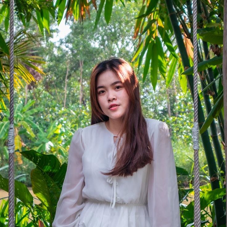 Ava Singh, Lead Design Curator at Beacon Quartz Lane, reviewing corporate floral arrangements